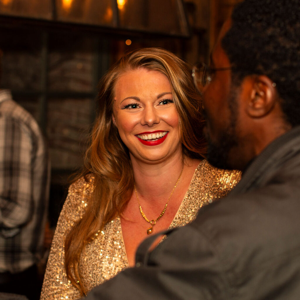 Two people chatting at a 20s & 30s Single & Mingle event.